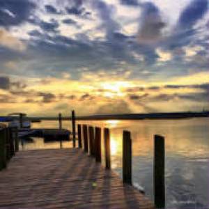 a sunset over a body of water