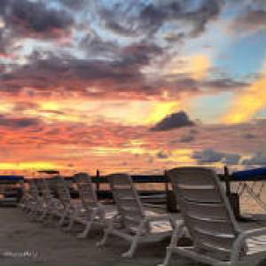 a sunset over a body of water