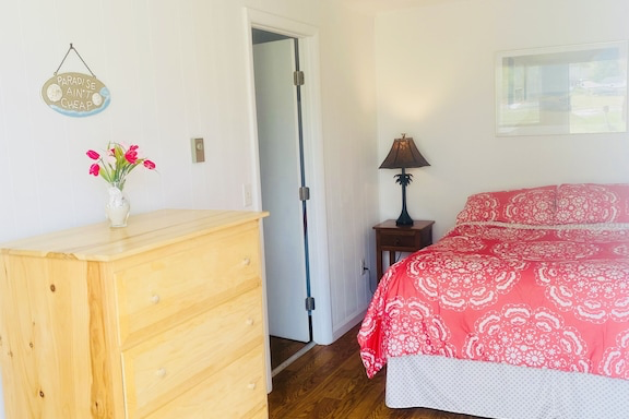 a bedroom with a bed in a room