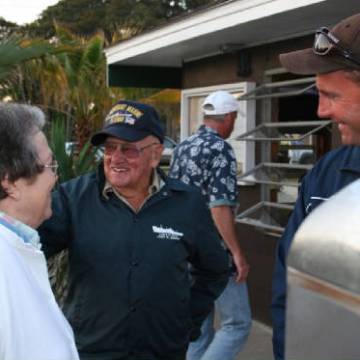 a group of people standing in a parking lot