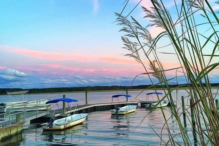 a boat is docked next to a body of water