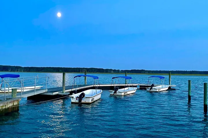 a boat is docked next to a body of water