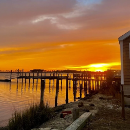 a sunset over a body of water