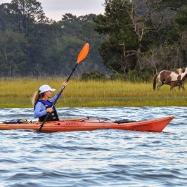 a man rowing a boat in the water