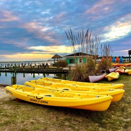a boat sitting next to a body of water