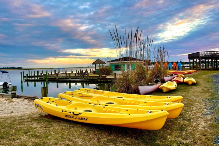 a boat sitting next to a body of water