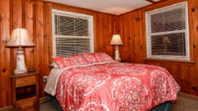 a bedroom with a large bed in a room