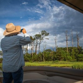 a person that is standing in the grass