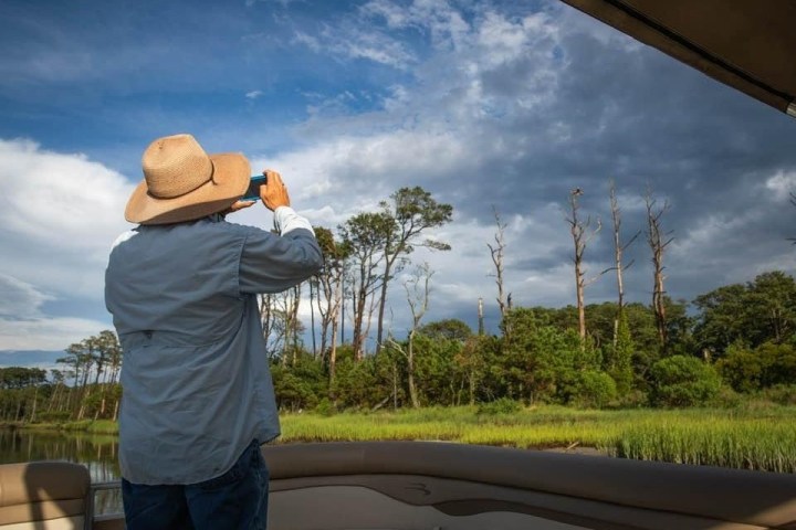 a person that is standing in the grass