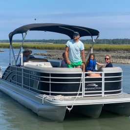 a man riding on the back of a boat