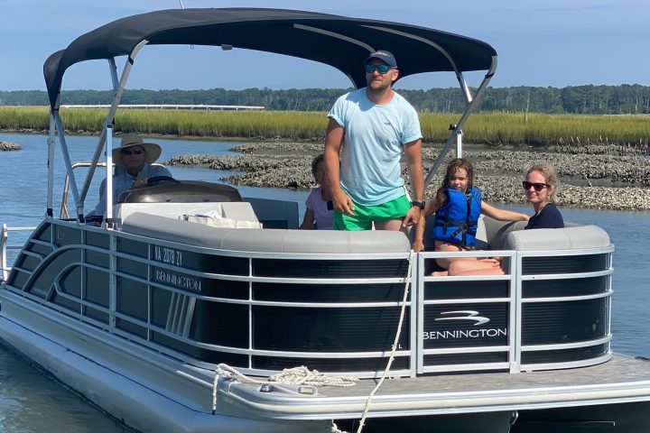 a man riding on the back of a boat