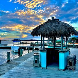 a close up of a pier next to a body of water